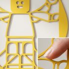 Vitruvius LEGO fém fali dísz acél anyagának közelképe, porfestett matt fekete bevonat